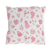 Pink beanies, mittens, cocoa mugs and snowflakes on white outdoor pillow