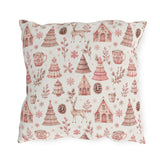 Pink patterned Christmas trees, deer, gingerbread houses and cocoa mugs on cream outdoor pillow