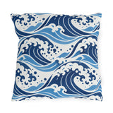 Coastal outdoor pillow with rolling navy and sky blue ocean waves and white foam crests