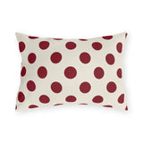 Merlot polka dot outdoor lumbar pillow with large deep wine purple dots on cream