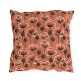 Coral poppies and black seed heads on terracotta outdoor pillow