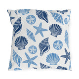 Coastal outdoor pillow with navy and sky blue seashells, starfish and sand dollars on white