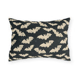 Bone white bats on a charcoal outdoor lumbar pillow, worn block print Halloween pattern
