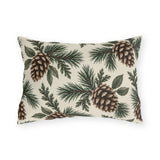 Large pinecones on pine and cedar branches on a cream outdoor lumbar pillow