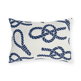 Nautical outdoor lumbar pillow with navy sailor rope knots, loops and coils on warm white