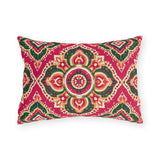 Boho outdoor lumbar pillow with Moroccan medallions in emerald green, orange and cream on raspberry pink