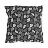 Charcoal, grey and white autumn leaves on black outdoor pillow