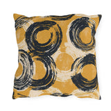 Navy brushed circles on a mustard yellow outdoor pillow