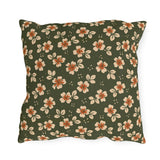 Cream blossoms with rust centres on a deep olive outdoor pillow, block print floral