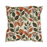 Rust leaves, olive seed pods and small blooms block printed on a cream outdoor pillow