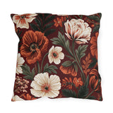 Floral outdoor pillow with painted rust poppies, cream anemones and dark green leaves on burgundy