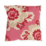 Floral outdoor pillow with oversized cherry red and cream peonies on bright pink
