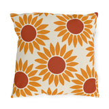 Modern outdoor pillow with bold retro sunflowers in orange and rust on cream
