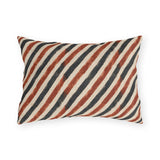 Diagonal rust and charcoal block-printed stripes on cream outdoor lumbar pillow