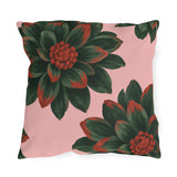 Floral outdoor pillow with oversized dark green dahlias tipped in rust red on blush pink