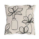 Black line-drawn plants in bottle vases on a cream outdoor pillow