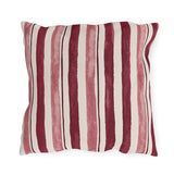 Cranberry and rose painted stripes on a cream outdoor pillow