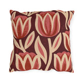 Oversized block print tulips in rose and cream on a deep oxblood outdoor pillow