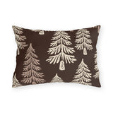 Cream fir trees on a dark chocolate outdoor lumbar pillow