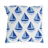 Coastal outdoor pillow with rows of cobalt and sky blue sailboats and waves on white