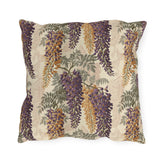 Cascading purple and amber wisteria with sage leaves on a cream outdoor pillow
