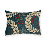 Cream laurel branches and red berries on a deep teal outdoor lumbar pillow
