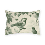 Green outdoor lumbar pillow with engraved toile songbirds, blossoms and bees on cream