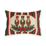 Vintage Christmas nutcracker outdoor lumbar pillow with a framed nutcracker soldier, pine and a red bow on red, green and cream stripes