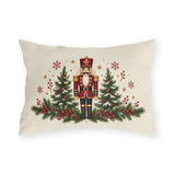 Christmas nutcracker outdoor lumbar pillow with a nutcracker between pine trees, berries and snowflakes on cream