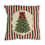 Vintage Christmas tree outdoor pillow with a lit fir tree and red bow in a cream panel on red, green and cream stripes