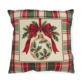 Christmas ornament plaid outdoor pillow with a vintage holly bauble and red ribbon in a cream panel on green and red tartan