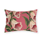 Floral outdoor lumbar pillow with painted cream foxgloves speckled in crimson and green leaves on rose pink