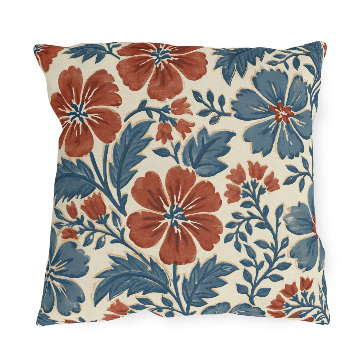Block print floral outdoor pillow with brick red and denim blue flowers and leaves on cream
