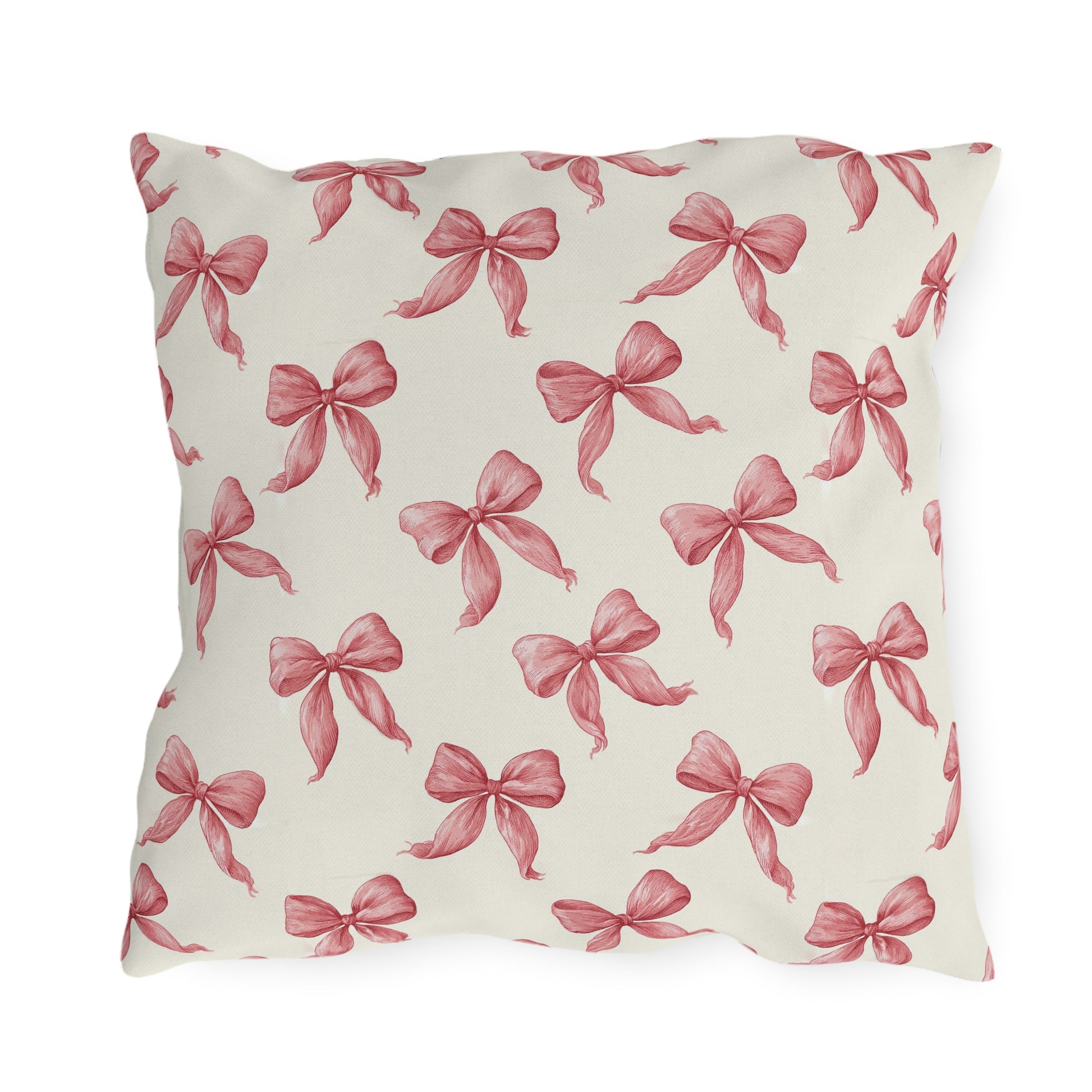 Rose pink engraved ribbon bows scattered on cream outdoor pillow