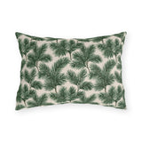 Deep green pine and fir branches on cream outdoor lumbar pillow