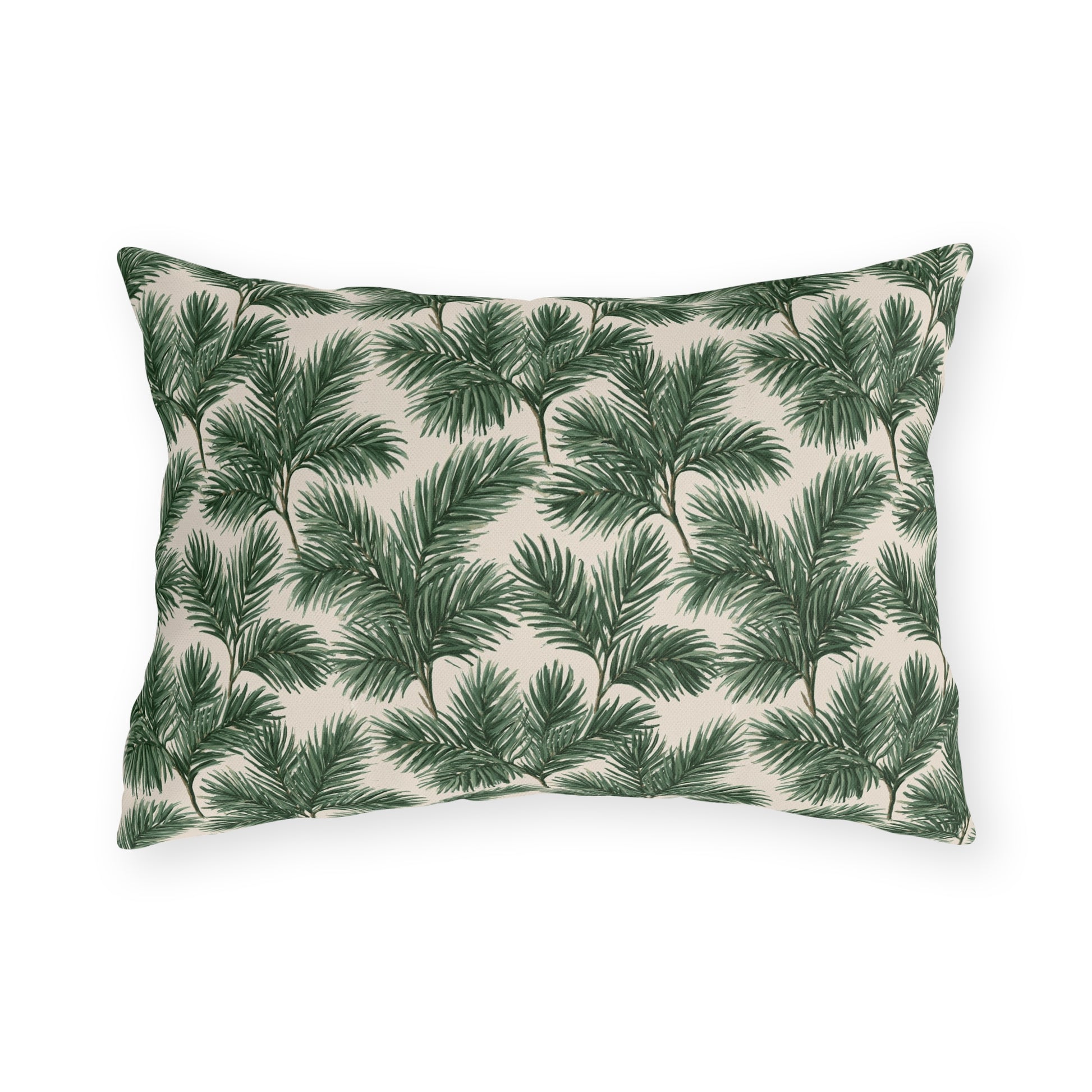 Deep green pine and fir branches on cream outdoor lumbar pillow