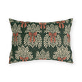 Cream foliage sprays tied with clay bows on a deep forest green outdoor lumbar pillow