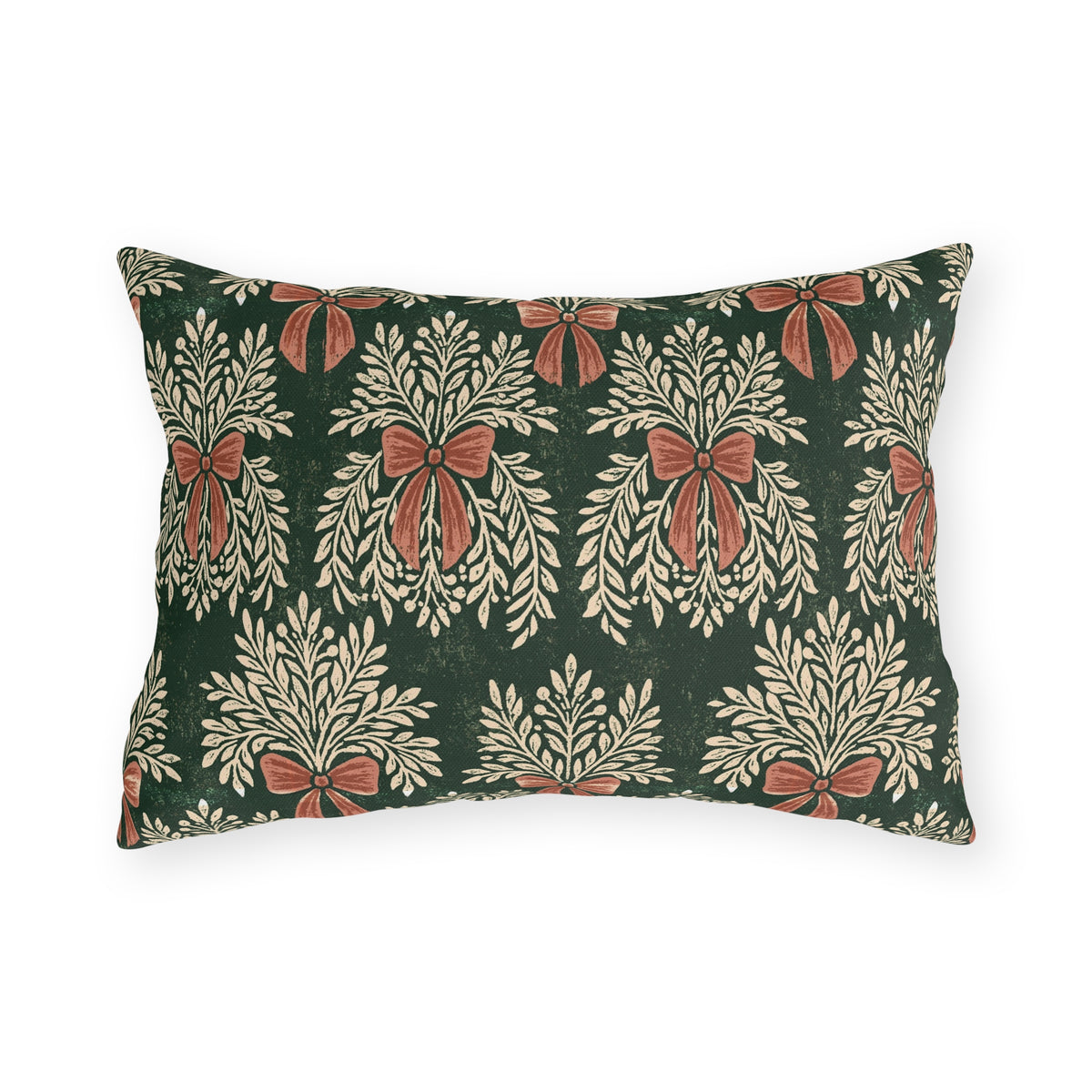 Cream foliage sprays tied with clay bows on a deep forest green outdoor lumbar pillow