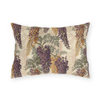 Cascading purple and amber wisteria with sage leaves on a cream outdoor lumbar pillow