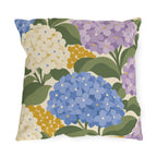 Hydrangea outdoor pillow with periwinkle blue, lilac and cream hydrangea blooms and sage green leaves