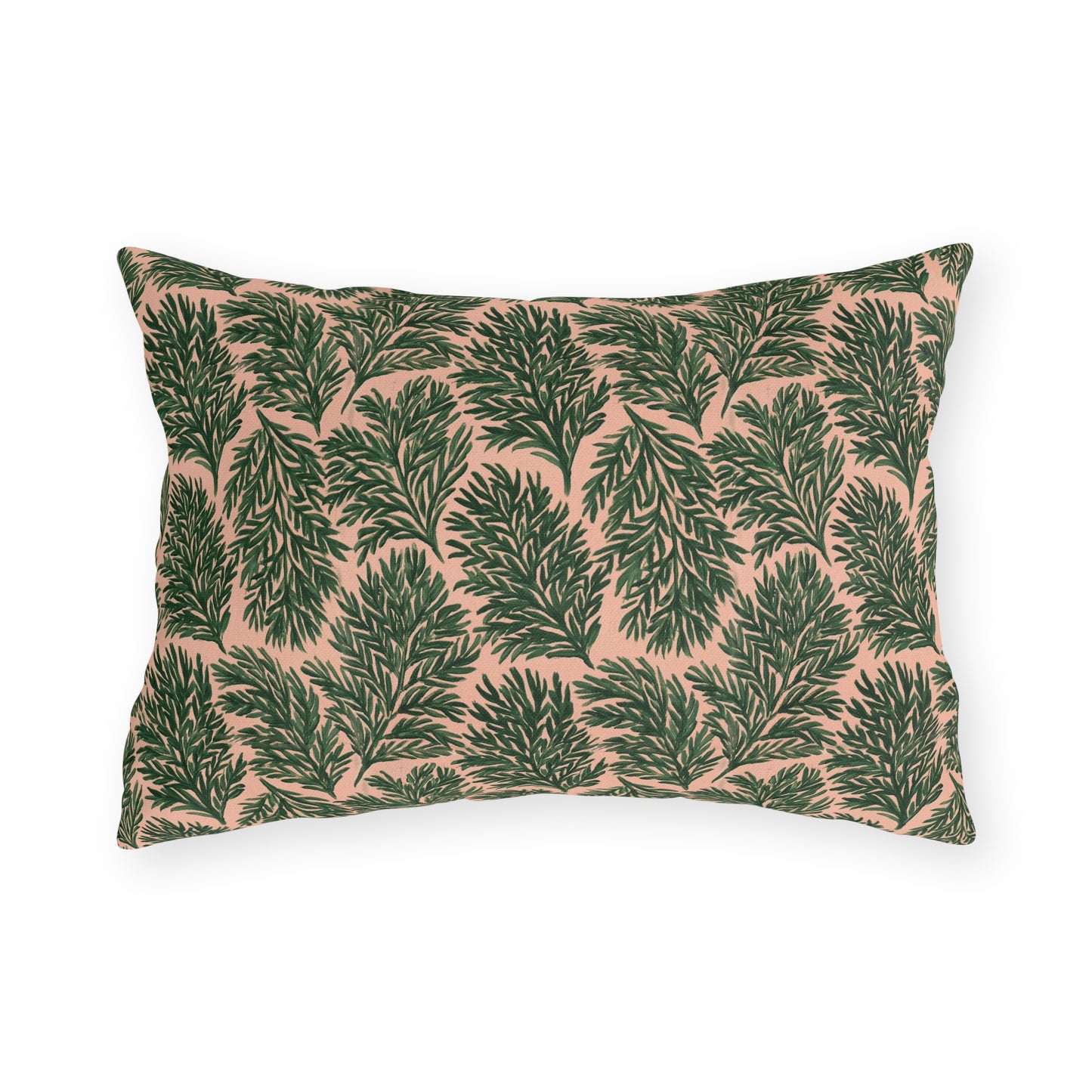 Dark green pine sprigs on blush peach outdoor lumbar pillow