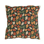 Rust, orange and cream autumn leaves on forest green outdoor pillow