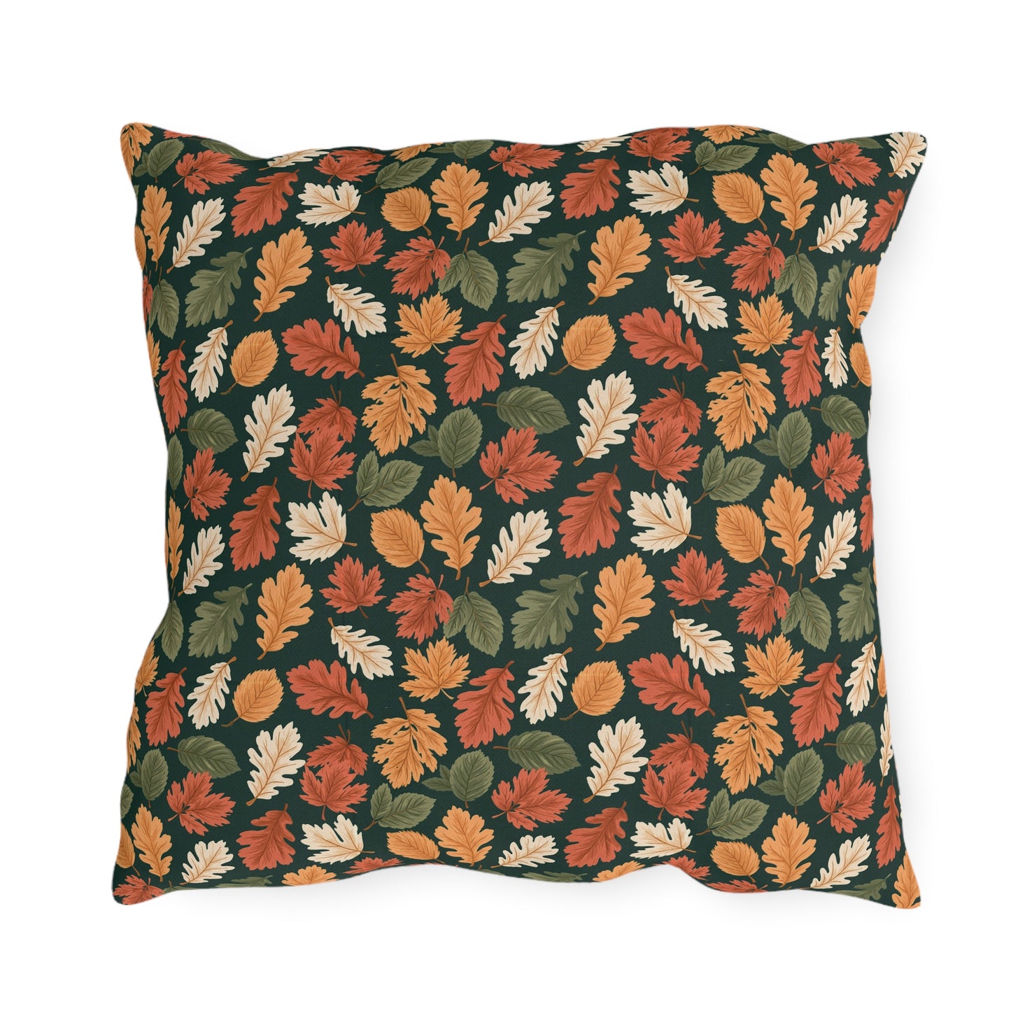 Rust, orange and cream autumn leaves on forest green outdoor pillow