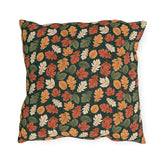 Rust, orange and cream autumn leaves on forest green outdoor pillow