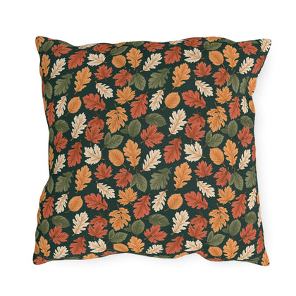 Rust, orange and cream autumn leaves on forest green outdoor pillow