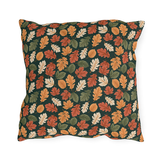 Rust, orange and cream autumn leaves on forest green outdoor pillow
