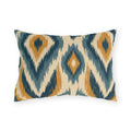 Boho outdoor lumbar pillow with an ikat diamond pattern in navy, slate blue and mustard on cream