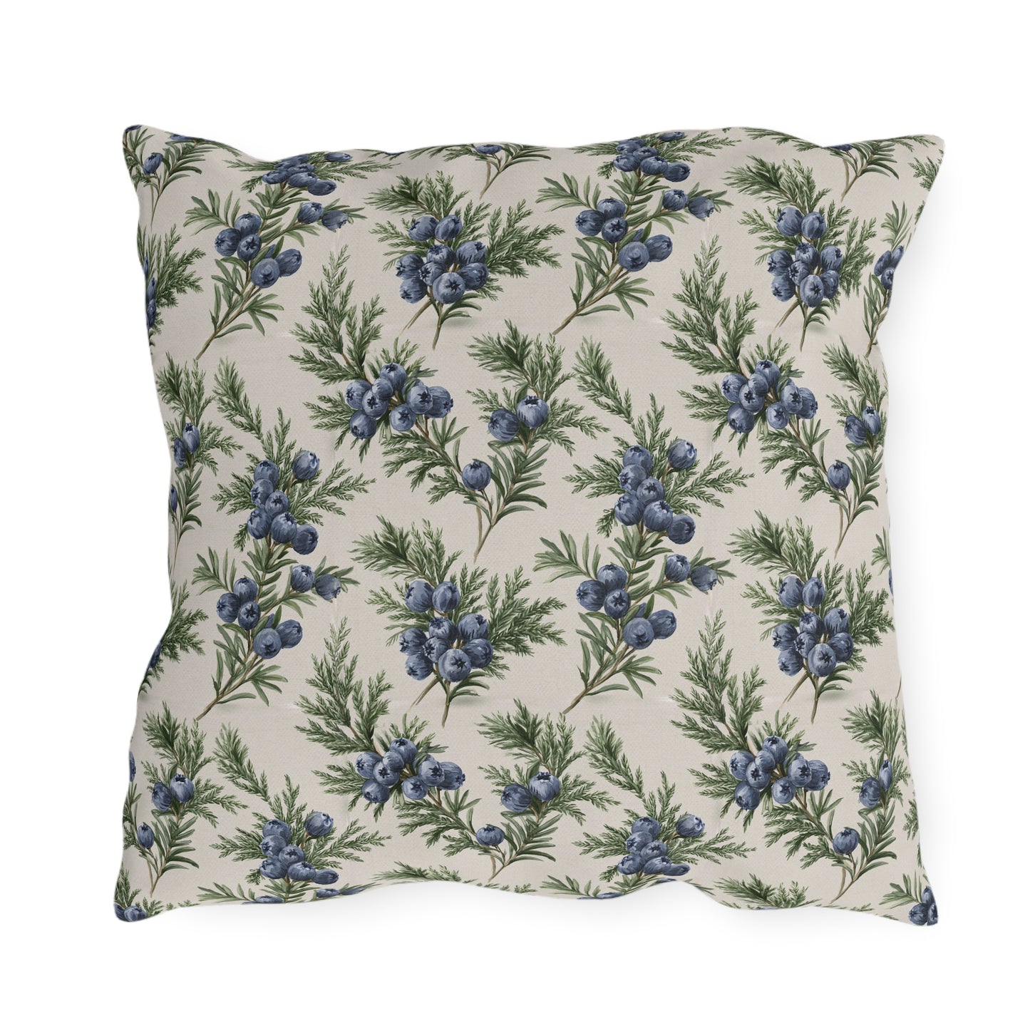 Blue juniper berries and green foliage on cream outdoor pillow