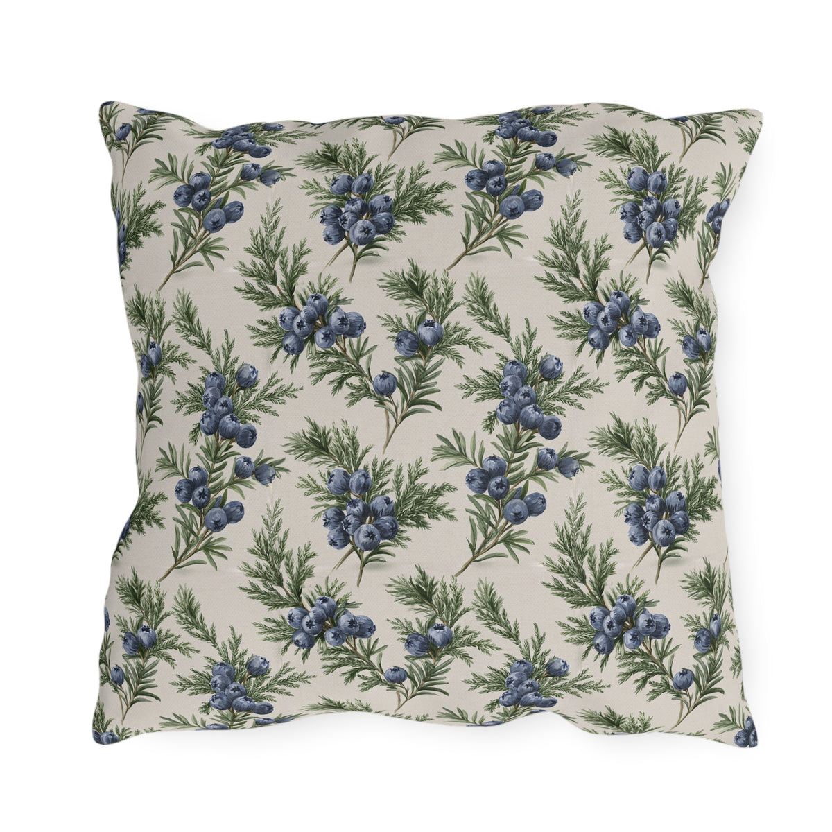 Blue juniper berries and green foliage on cream outdoor pillow