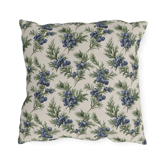 Blue juniper berries and green foliage on cream outdoor pillow